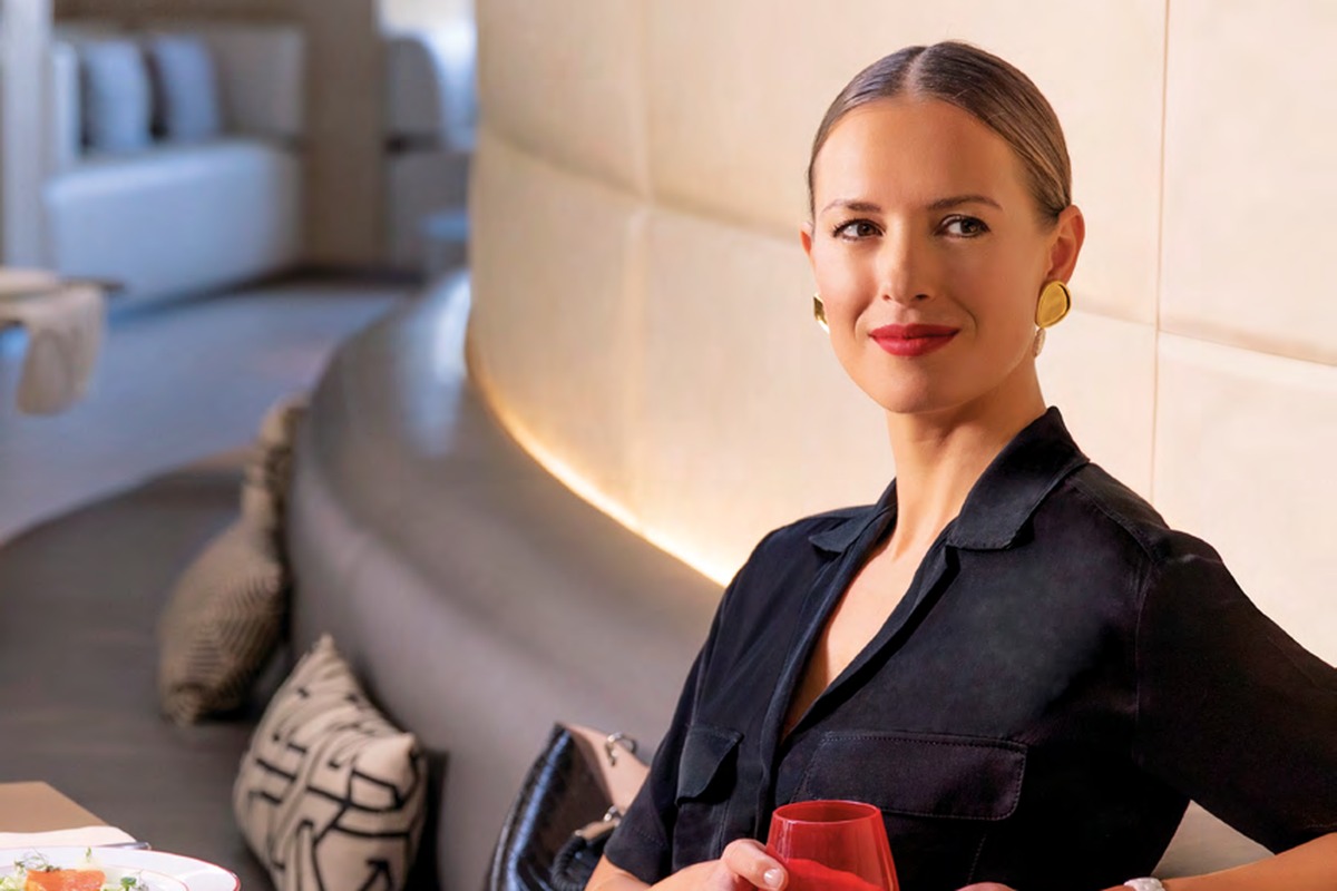 Air France La Première lounge dining at CDG — passenger with Alain Ducasse menu, Sisley spa access included