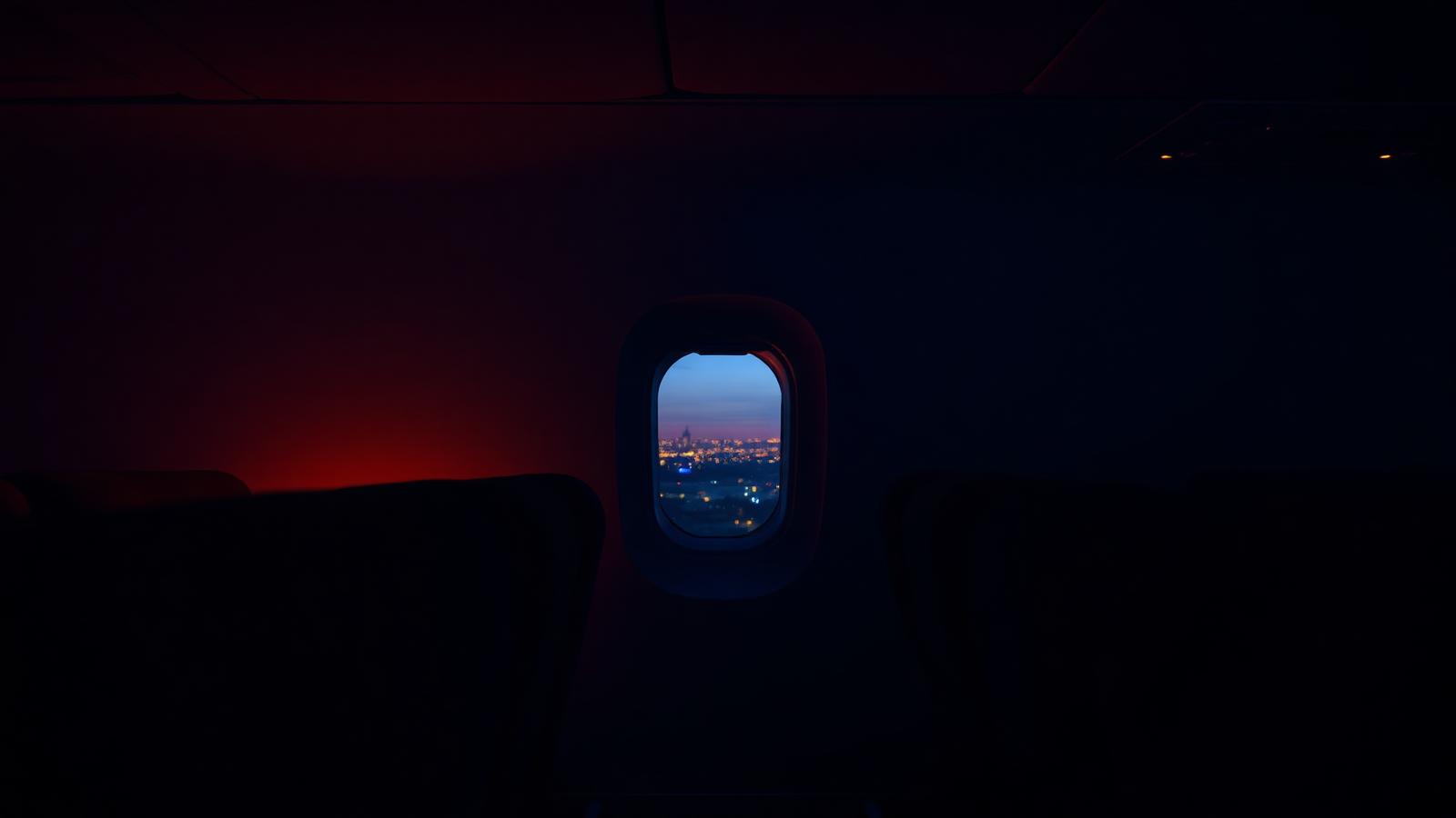 First class cabin window at dusk