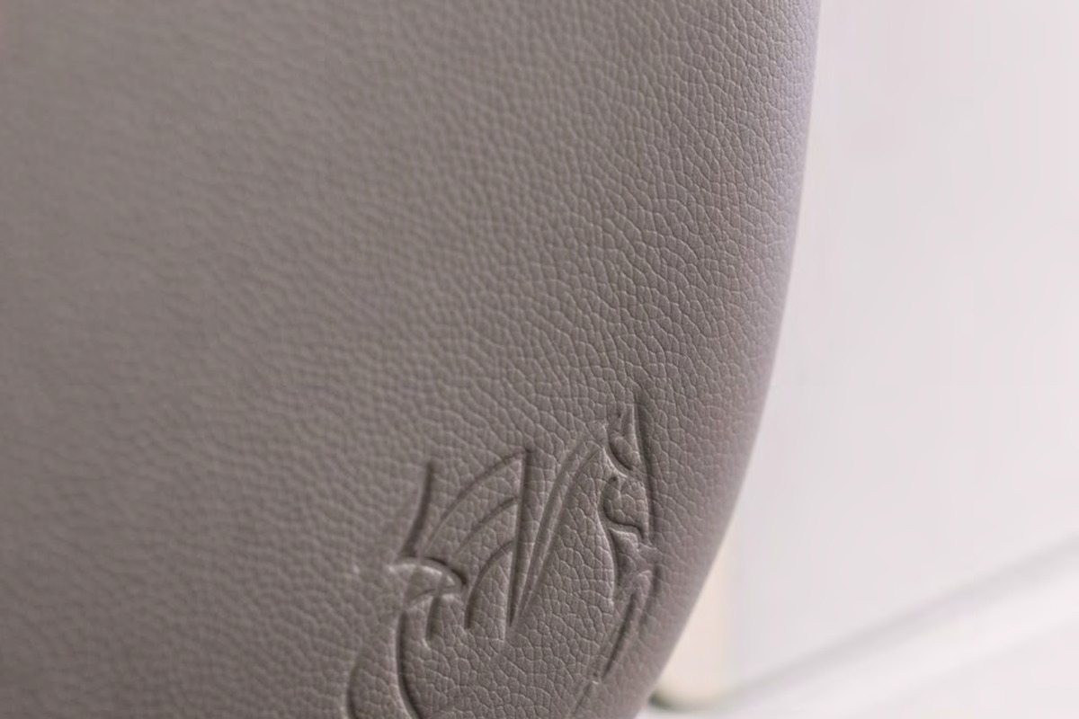 Air France winged seahorse embossed on full-grain leather La Première headrest